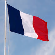A French flag, with blue, white, and red vertical stripes