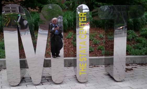 3 large standing mirrored letters spelling 'MIT'