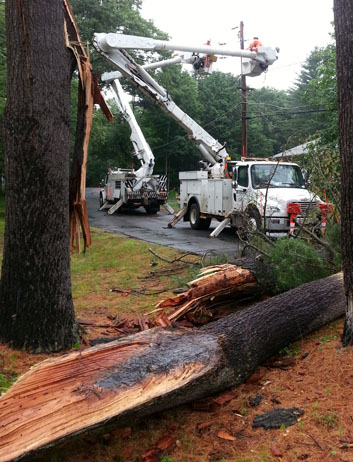 NStar crews at work, with 2 bucket trucks, buckets up