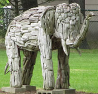 Statue of elephant made out of blocks of wood