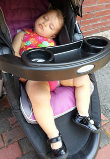 Dar asleep in her stroller