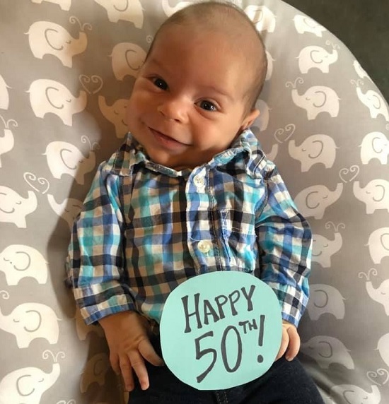 Simon wearing a 'Happy 50th!' label