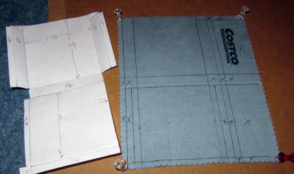 A paper pattern and an eye-glass cloth marked to be cut into the liner